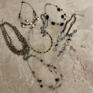 Variety of Lia Sophia necklaces. Earth tones, purple, black and grey